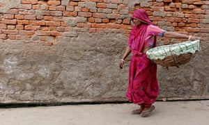 Asha Devi collects human excreta from the toilets on her basket and disposes of at a dumping ground outside the village. Out of an estimated 900 households in the village around 120 have dry toilets which are daily serviced by the village’s six manual scavengers, including Devi.