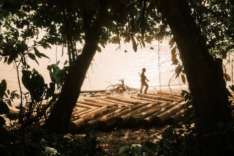A fighter walks across a wooden raft
