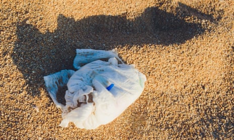 Disposable nappy on a beach