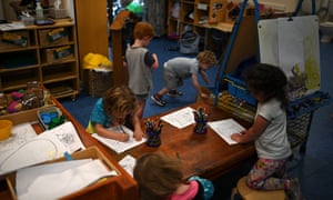 A small group of children play at the Robertson Street Kindy Childcare Centre in Helensburgh south of Sydney