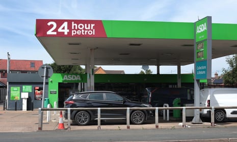 A car parked on the forecourt of an Asda 24-hour petrol station