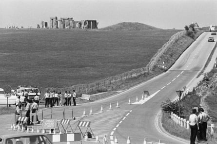 Stonehenge stands in the background of the road block.