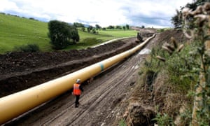 An engineer walks along a stretch of National Grid gas pipeline near Skipton in North Yorkshire. 