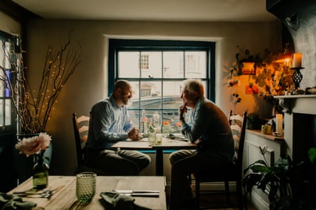 Ben and Neil chatting across a restaurant table