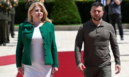 Volodymyr Zelenskiy walks with Slovakia’s president, Zuzana Čaputová, in the grounds of the presidential palace in Bratislava.