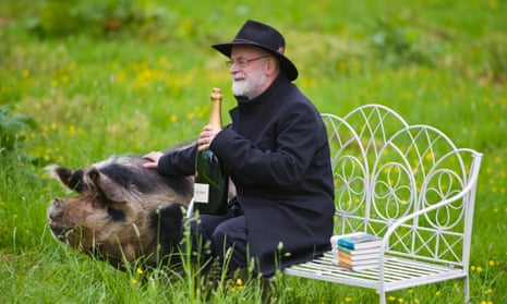 Terry Pratchett pictured in 2012 after winning the Wodehouse prize for his novel Snuff – with his Bollinger and porcine prize.