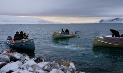 Hunters prepare to hunt narwhal after a pod was spotted entering the sheltered bay near Clyde River.
