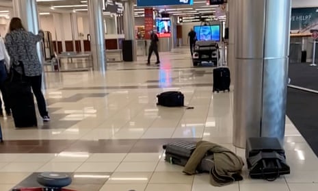 Luggage is seen on the ground at the Hartsfield-Jackson Atlanta airport on 20 November in an image obtained from a social media video.
