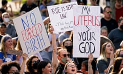 people hold signs in support of abortion rights