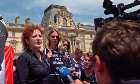 Nan Goldin leads a protest outside the Louvre in Paris.