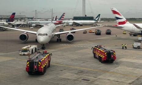 Virgin Atlantic plane's wing touching a British Airways aircraft, surrounded by emergency services at Heathrow airport. 