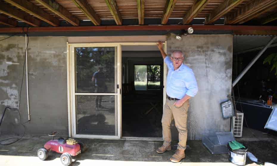 The prime minister, Scott Morrison, at a flood-damaged house in McGraths Hill in Sydney.