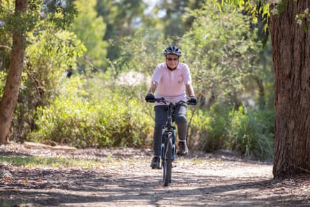 Trevor Gough, aged 85, rides his bike in a park