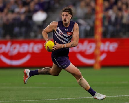 Luke Jackson of the Dockers runs the ball