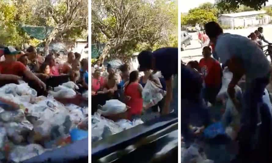 A criminal group hands out food supplies in the Mexican city of Apatzingán in Michoacán, Mexico.