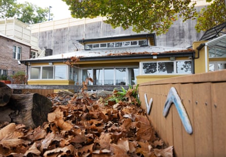 A pile of leaves in front of an empty building