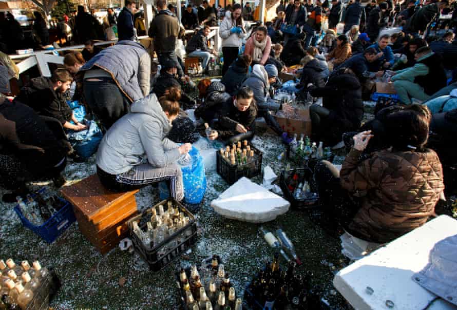 Local residents prepare Molotov cocktails to defend the city of Uzhhorod, Ukraine on 27 February.