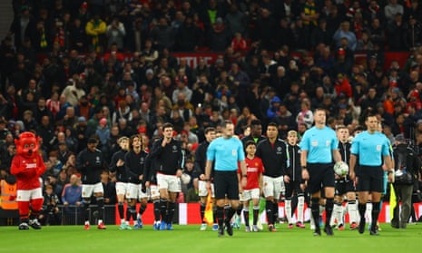 Manchester United's Casemiro leads out Andre Onana, Harry Maguire and teammates take to the pitch ahead of the Carabao Cup game against Newcastle United.