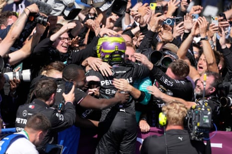 Mercedes driver Lewis Hamilton of Britain celebrates with his team.