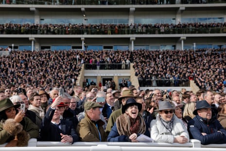 Cheltenham Festival 2023: Constitution Hill goes for glory in Champion Hurdle – live | Cheltenham Festival 6 The crowd watch the opening race in the sunshine of Gloucestershire.