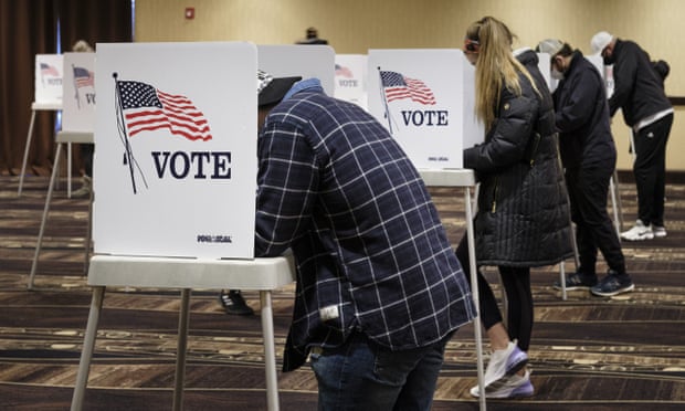 People fill out their ballots at voting booths in West Des Moines, Iowa, in November 2020.