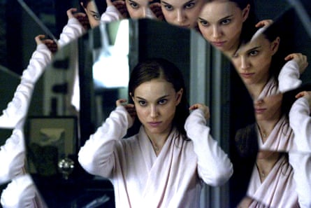 Portman looking at many reflections of her image in a mirror.