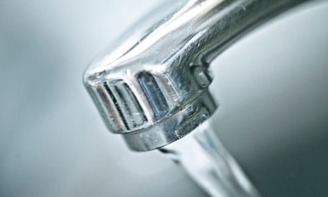 Close-up of water pouring from a kitchen tap
