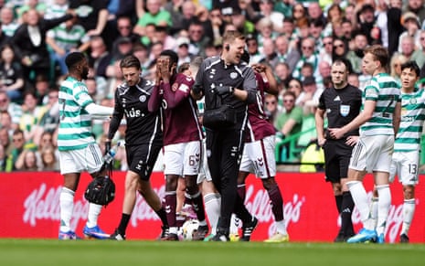 Heart of Midlothian's Beni Baningime walks off injured.