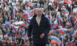 Russian President Vladimir Putin attends a concert marking the eighth anniversary of Russia’s annexation of Crimea.