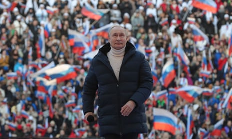 Russian President Vladimir Putin attends a concert marking the eighth anniversary of Russia’s annexation of Crimea.