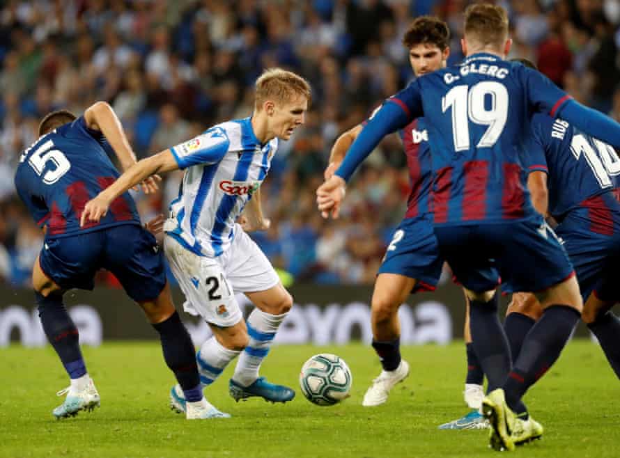 Martin Odegaard (L) tries to get the better of a clutch of Levante players while with Real Sociedad last season.