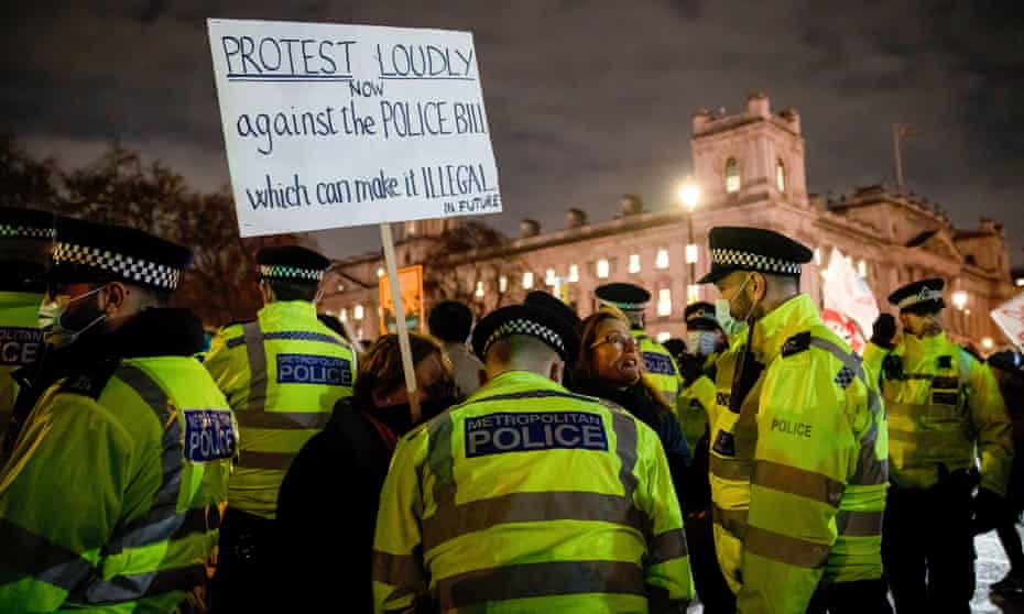 A protester is confronted by police during a demonstration in Parliament Square, London