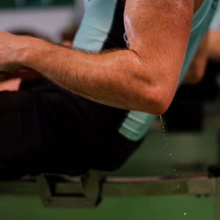 Seb Benzecry, men’s president of the Cambridge University Boat Club, sweats profusely during a long session on an ergo machine at the Goldie boathouse, Cambridge in February 2024.