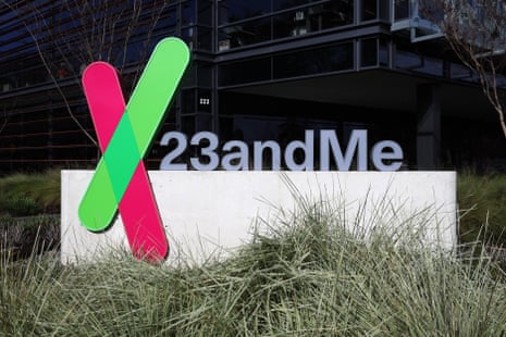 a sign for 23andme with grass in front.
