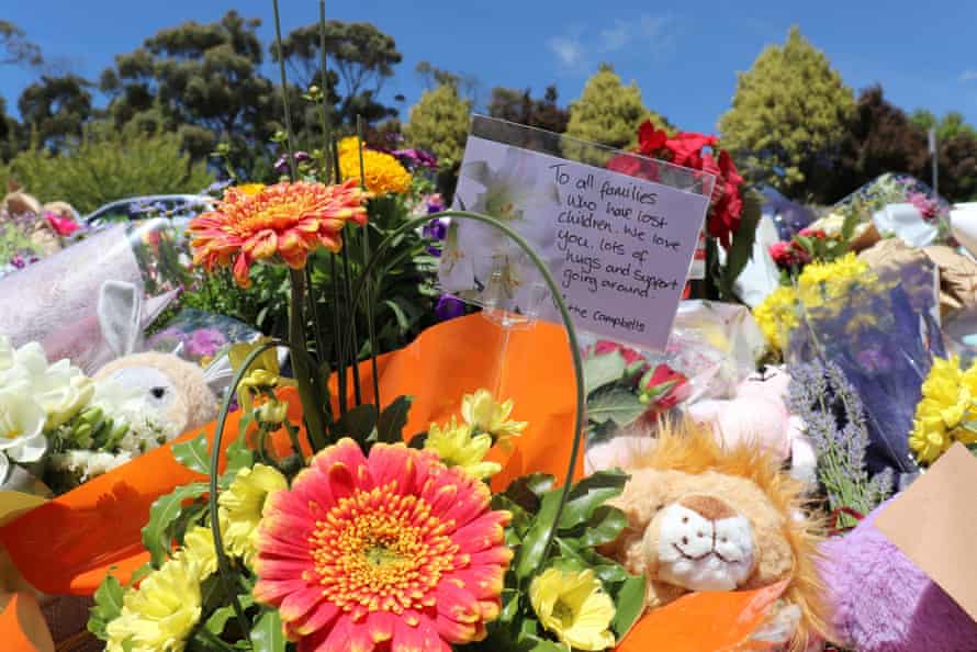 Flowers and tributes are seen outside Hillcrest Primary School in Devonport, Tasmania.