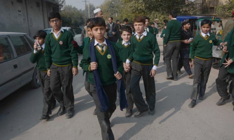 Pakistani students near the site of the attack.