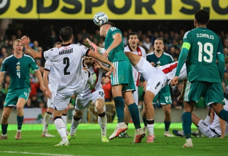 Georgia's Nodar Lominadze fouls Northern Ireland's Ruairi McConville leading to a penalty.