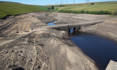Low water levels at Baitings reservoir in Ripponden, West Yorkshire, reveal an ancient packhorse bridge in August 2022.
