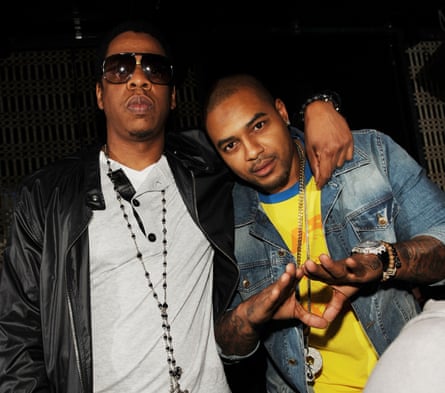 Jay-Z, left, and former NFL running back Larry Johnson attend a pre-fight party at Lavo in Las Vegas on 1 May 2009.