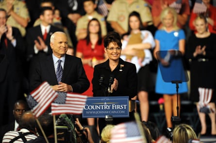 man and a woman surrounded by people