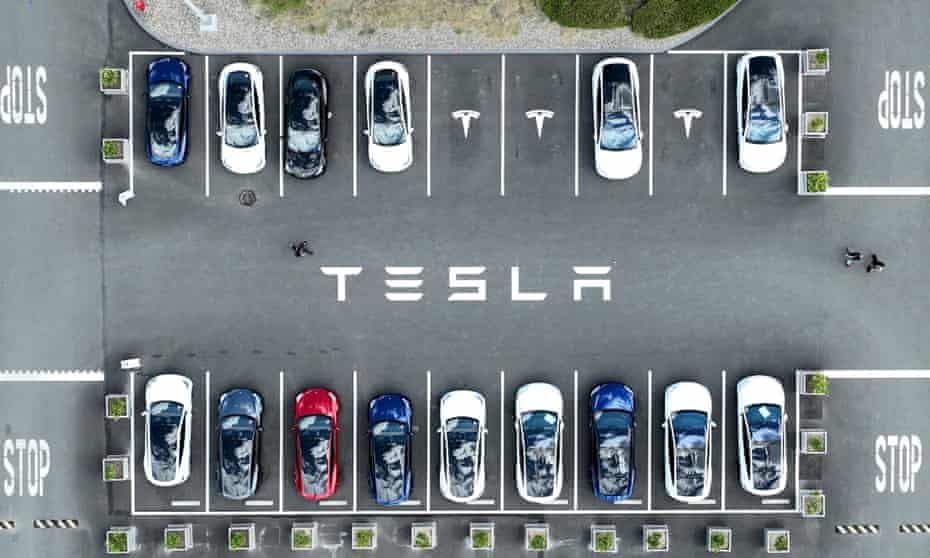 Tesla cars parked in a lot at the Tesla factory in Fremont, California.