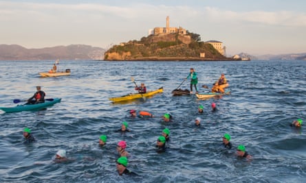 The pull of the Rock … swimmers during a November crossing from Alcatraz Island to San Francisco.