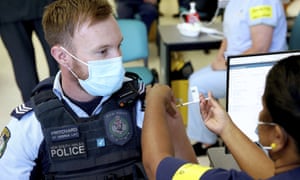 NSW police officer Lachlan Pritchard receives the Pfizer vaccine at the Royal Prince Alfred hospital vaccination hub in Sydney on Monday.