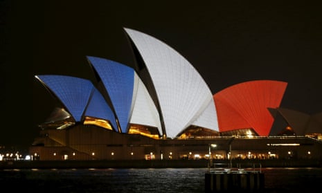 The blue, white and red colours of France's national flag are projected onto the sails of Sydney's Opera House.