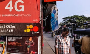 Advertisements for telecom operators at a store in Mumbai, India