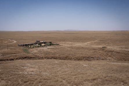 A small settlement in a dry grassy landscape