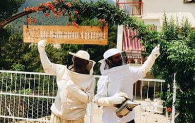 Ali and Aysin in their beekeeping suits