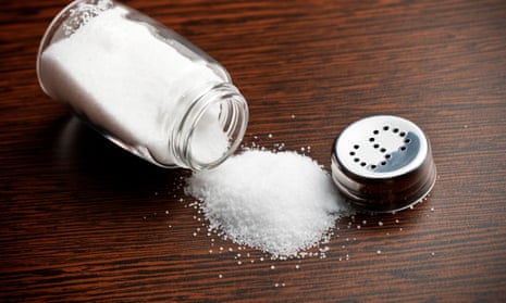 Salt sprinkled on wooden table