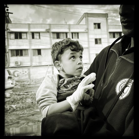 A PRCS paramedic carries a child