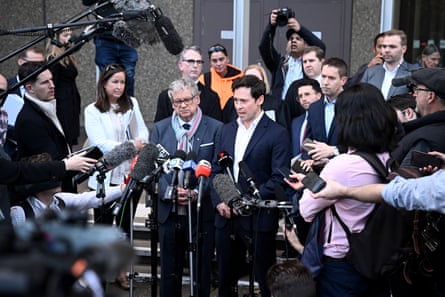Journalists Nick McKenzie and Chris Masters give a statement outside the federal court, in Sydney.